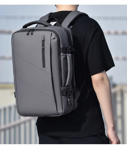Mochila  – Impermeável, Expansível, com Porta USB e Compartimento para Notebook 15.6”